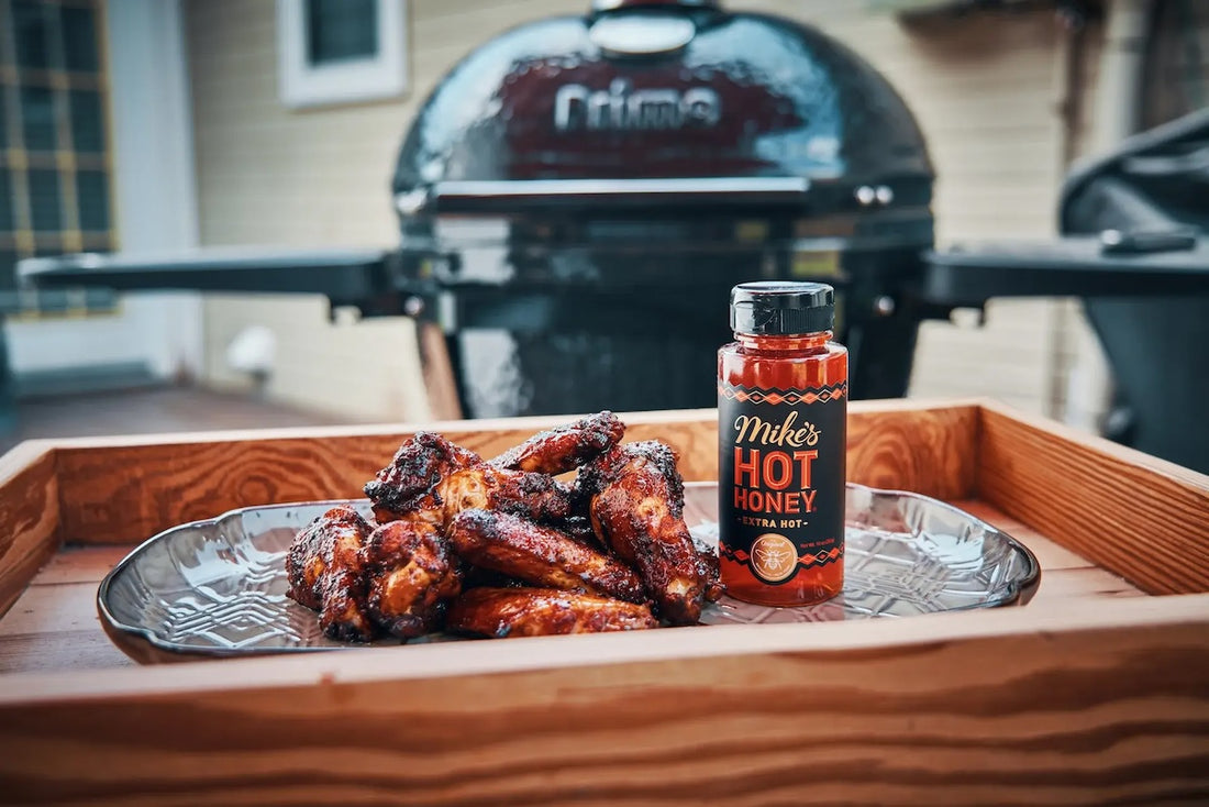 Mike's Extra Hot Honey beside chicken wings